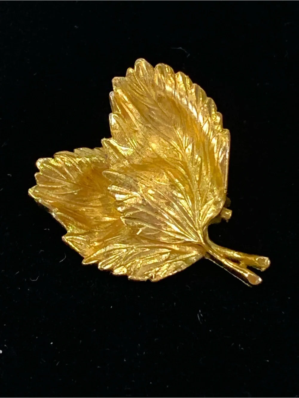 Beautiful vintage Marvella brooch in the shape of a curled leaf, done in brushed